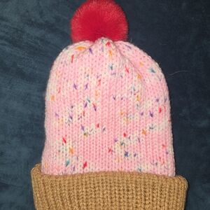 Playful Pink Knit Beanie with Red Pom Pom